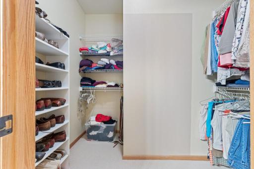 You'll find a spacious walk-in closet through the primary bathroom