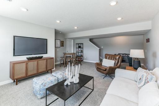 This lower level rec room features great game and gathering space for everyone!