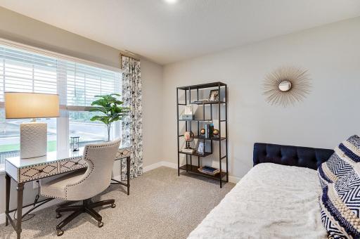 The bonus room on the main level can be used as a bedroom, home office, home gym, and more! Staged model photograph, some options and colors may vary.
