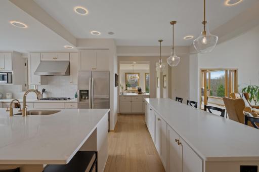 Spacious island with seating AND buffet counter with even more seating.