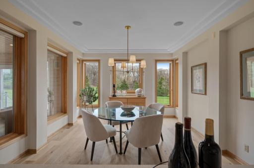 Beautiful formal dining with tons of windows, and access to the 3-season porch.