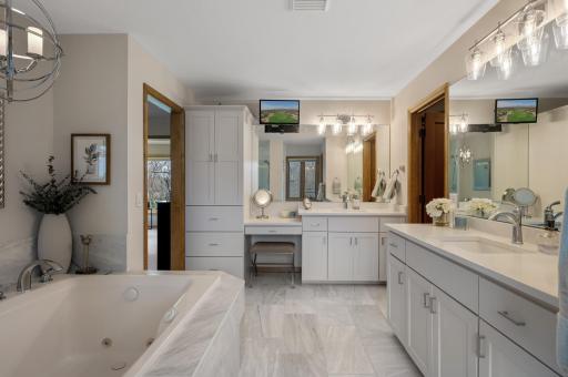Fully updated private full bathroom with dual vanities.