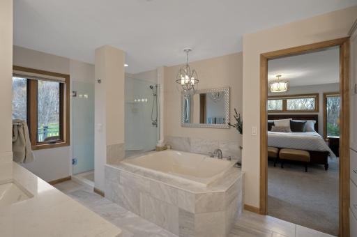 Huge jetted tub for ultimate relaxation, and a separate tiled shower.