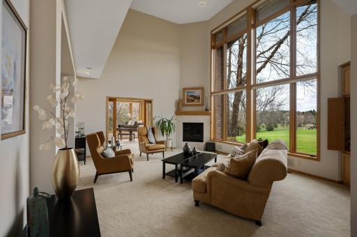 A wonderful first impression with a soaring two-story great room boasting incredible floor to ceiling windows.