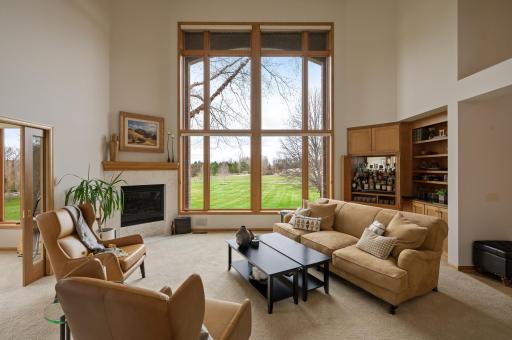 Cozy gas fireplace, and a custom liquor cabinet and built-ins.
