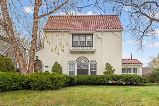Welcome to 5636 21st Ave S. Elegant Mediterranean style home just a block from Lake Nokomis!