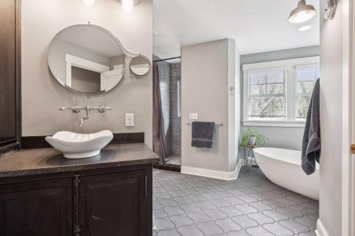 A second view of the primary bath showing the second vanity and another view of the great soaking tub.
