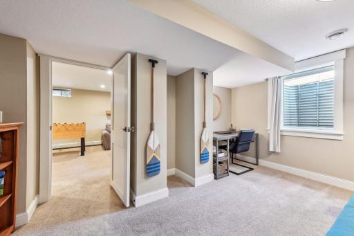 In the lower level, you'll find the 6th bedroom, used as a home office by the current owners.