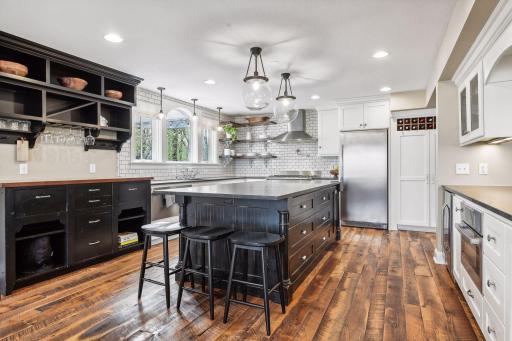 The kitchen is truly a dream. Loads of expansive counter space, endless cabinetry storage and an open concept layout are just a few of the fabulous features here.