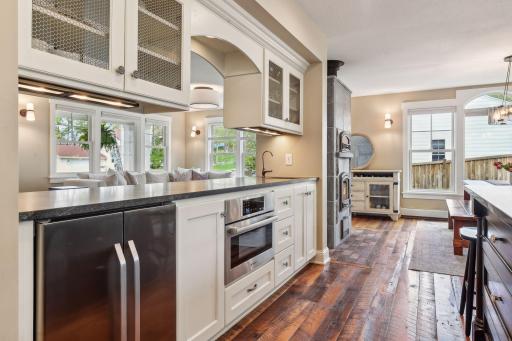 The main level brings the perfect balance of open concept and private spaces (you can catch a glimpse of the front family room just beyond the kitchen counter in this photo).