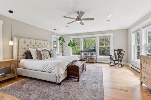 The primary suite is a true treetop oasis.