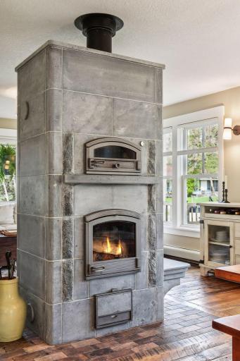 Imported from Finland, the Tulikivi soapstone wood fireplace and oven is the ultimate in wood stove luxury. Enjoy long lasting heat retention, and even bake pizza or bread. The sellers have loved family pizza nights here!
