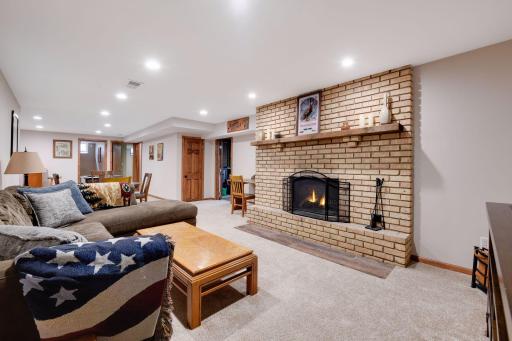 The lower level was recently updated and features a huge family room space, big enough for a large sectional, game table, and even a bar. (Note fireplace has not been used by the sellers and the flames have been simulated).
