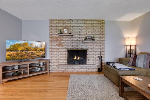 Fabulous brick fireplace (note that it has not been used by the current owners and the flames are simulated).
