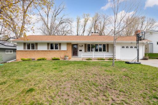 Welcome home to 9232 W 23rd Street. Perfectly sited in a quiet neighborhood, this one is chock full of curb appeal from the concrete driveway to the cute front porch.