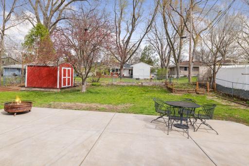Enjoy summer on the large patio. The backyard is level and fully fenced for recreation and relaxation.