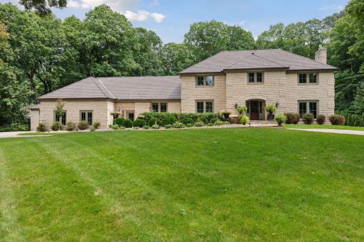 Stunning executive limestone front estate with circular drive.
