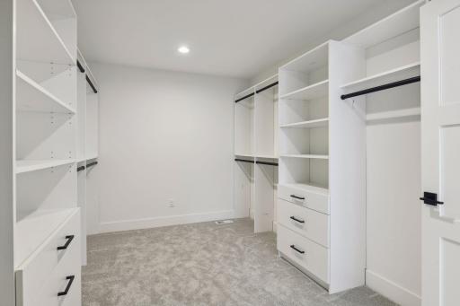 Large walk-in closet. Photos are from a previously built home.