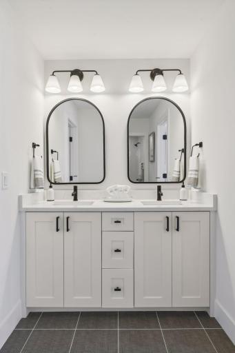 Jack and Jill bathroom with double vanities. Photos are from a previously built home.