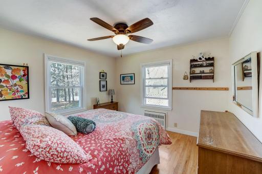 Spacious bedrooms with ceiling fans. Hardwood floors throughout.