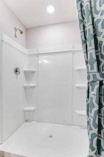 The private en suite bathroom features a spacious step in shower.