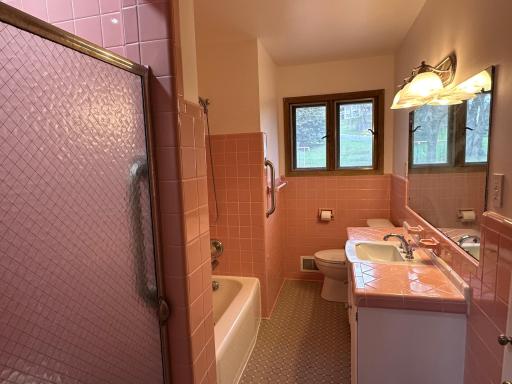 100% original classic MCM bathroom with separate shower. Amazing tile job here!