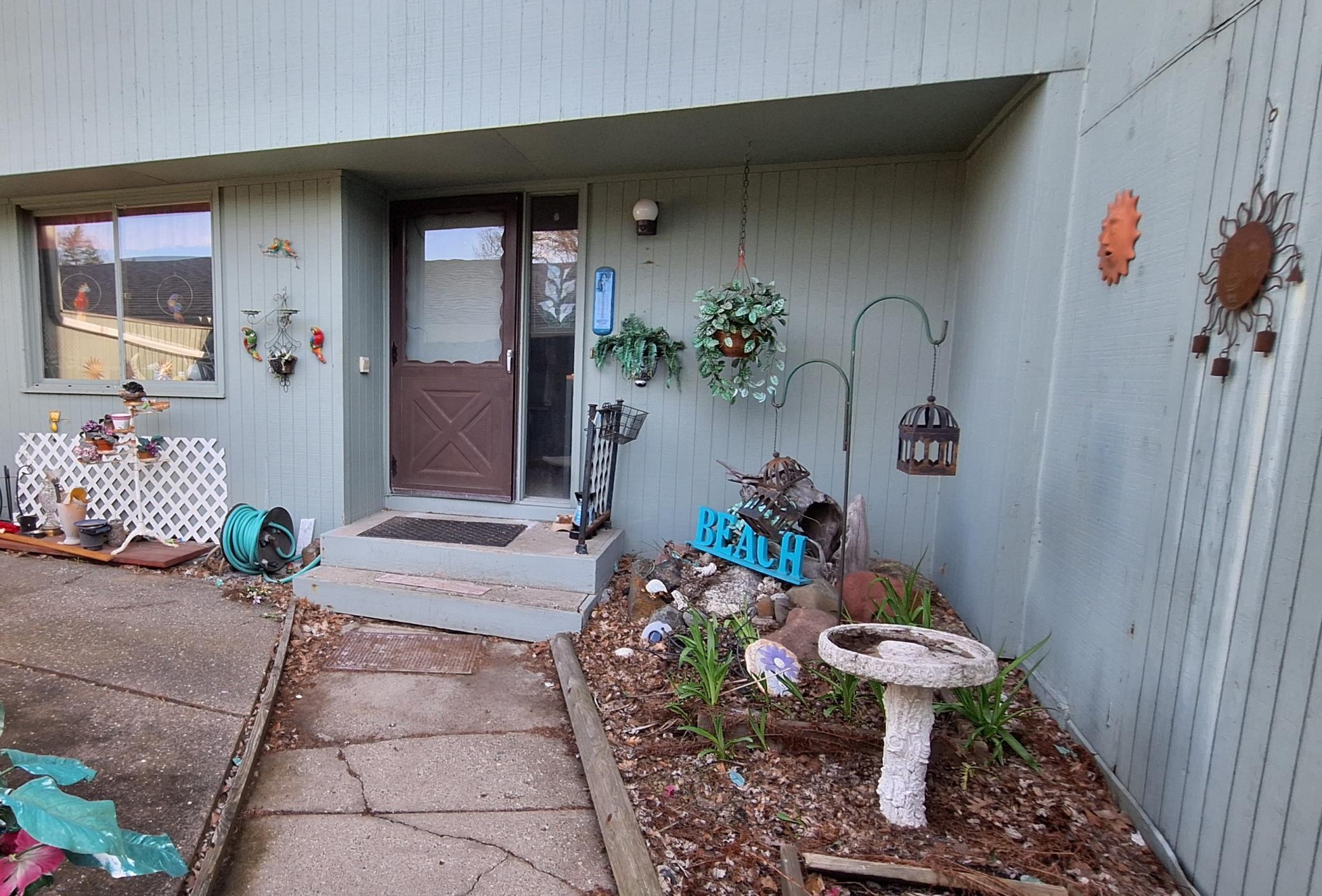 This lovely townhome needs some work but has wonderful potential! This private courtyard is one of three outdoor spaces that can belong to you! Make this courtyard your little oasis.