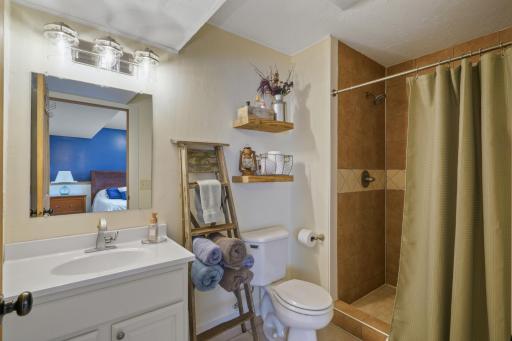 Primary Suite Bathroom w/ Tile Floors and Shower