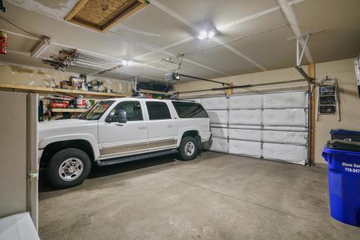 Insulated 2 car garage w/ tons of shelving