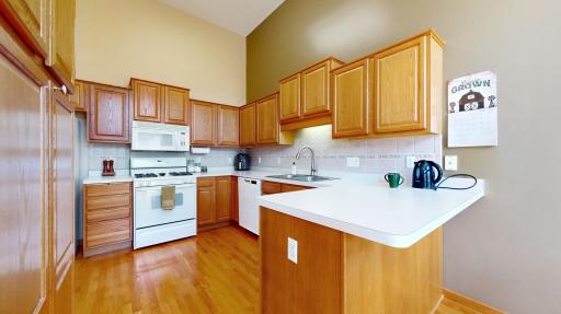 The large kitchen offers an abundance of counter space and plenty of cabinet storage!