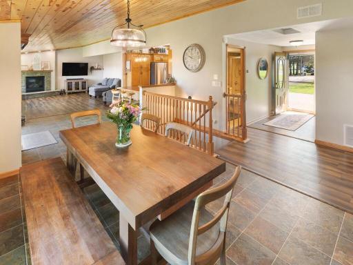 The spacious foyer leads to the dining room where you'll see open spaces with vaulted ceilings.