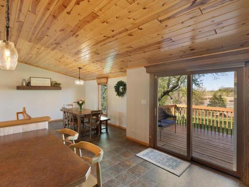 Numerous large windows and sliding doors bring in huge amounts of light and access to the outdoors. Views to the deck, breakfast bar, and dining room.