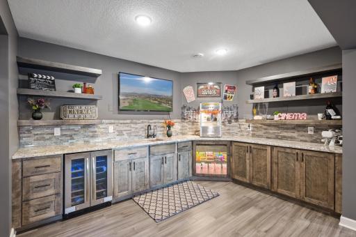 Ready to entertain? The amazing lower level features a wet bar.