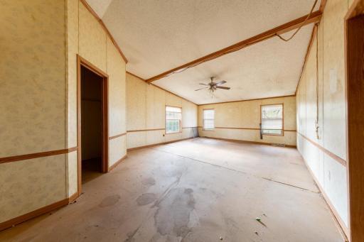 Primary bedroom with 2 walk-in closets