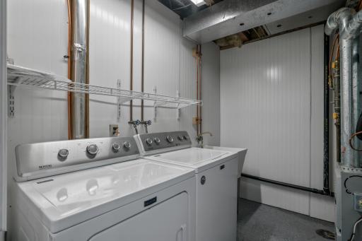 Laundry room with wash tub and updated HVAC