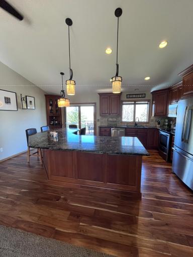Awesome kitchen with granite counters, huge center island, cherry cabinets, SS appliances.