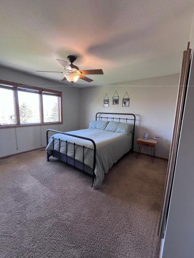 Primary bedroom with walk-in closet and 3/4 bath