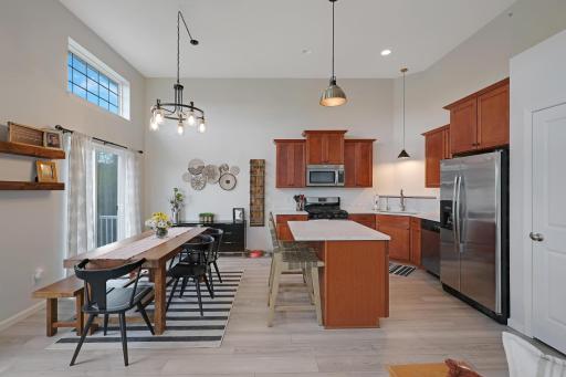 The kitchen features new white quartz countertops, stainless steel appliances and all new flooring