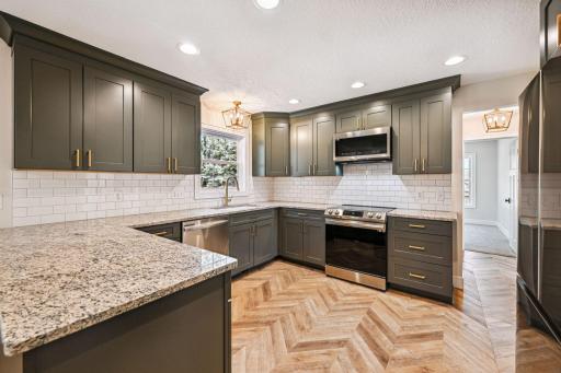 Fully Renovated Kitchen - New granite countertops, cabinetry, hardware, SS appliances, and sink