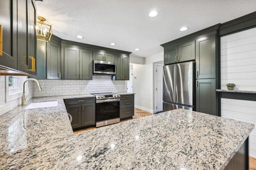 Fully Renovated Kitchen - New granite countertops, cabinetry, hardware, SS appliances, and sink