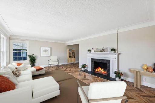 Living room - Featuring a beautiful wood burning fireplace. (Virtually staged furniture)