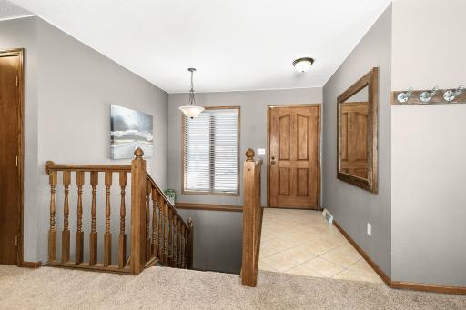 Large foyer entry with open stair case allows for good natural light