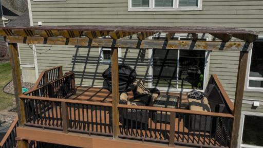 The large deck allows for grilling and seating.