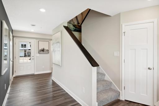 (Photo of decorated model, actual home's finishes may vary slightly) Make the best first impression with this bright and open foyer.