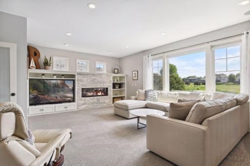 Beautifully updated, the Family Room features all new carpeting and a remodeled entertainment center with a linear gas fireplace and stone surround.