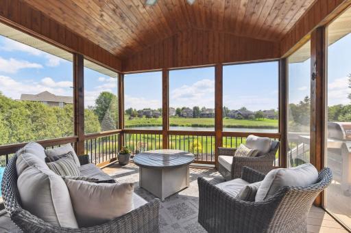 The "best room in the home"! The Screen Porch overlooks the pool and ponds. Sip your morning coffee or relax with your favorite beverage while taking in the gorgeous view.
