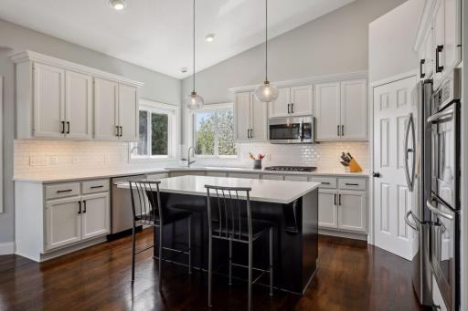 Nearly every surface of the home has been refreshed including new designer lighting, beautiful hardwood floors with a custom stain and enameled millwork and trim.