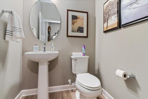 (Photo is of a model, homes finishes vary) Powder bath located on the main level.