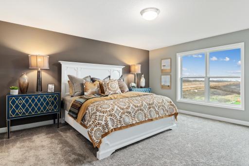 (Photo is of a model, homes finishes vary) Find your retreat in this stunning primary bedroom.
