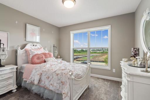 (Photo is of a model, homes finishes vary) The third spacious secondary bedroom.